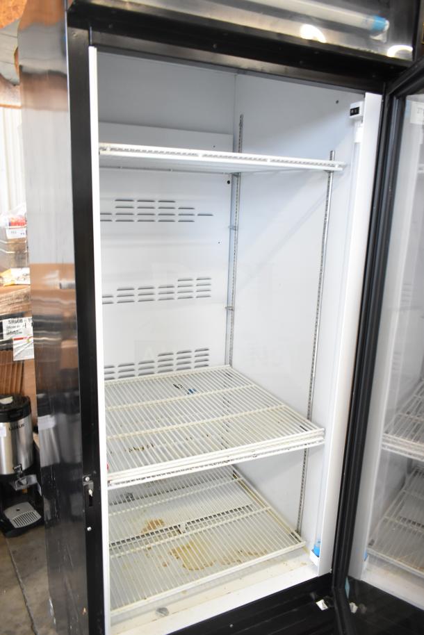 Royal Vendors RVCH-027-02 commercial single door reach-in cooler. Three shelves, visible use, 115 volts, 1 phase power.