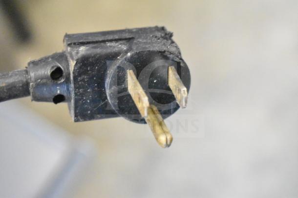 Close-up of a black electrical plug from the Royal Vendors RVCH-027-02 cooler, showing standard prongs.