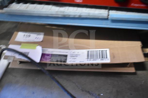 Two boxes of 3M carpet bonnets, 17" and 19", on a warehouse shelf. Boxes have visible barcodes and labels.