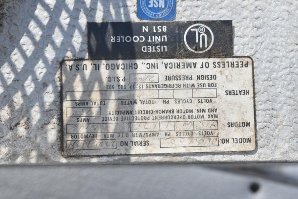 Label of a Peerless of America evaporator fan. Shows serial number, model, volts, amps, and UL listed mark.