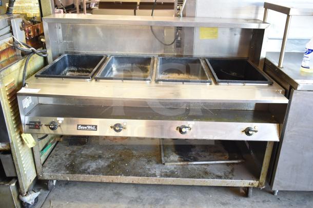 ServeWell Vollrath 38104 4-well steam table on wheels, 120V. Features include commercial casters, used condition.