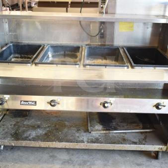 ServeWell Vollrath 38104 4-well steam table on wheels, 120V. Features include commercial casters, used condition.