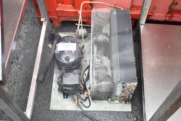 8'x12'x7' walk-in box with compressor and evaporator fan, missing door. Features visible compressor unit and protective mesh.