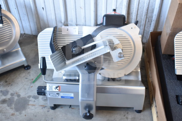 Brand new Globe SG13-84 commercial slicer, 13" blade, automatic, with sharpener, 110V, minor scratches and dents.