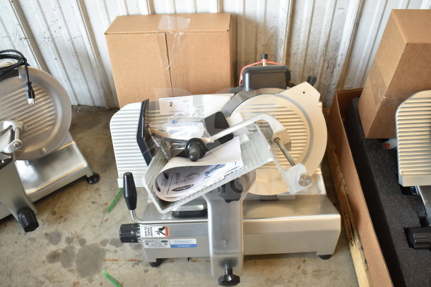 Globe SG13-84 Commercial 13" slicer, new condition with minor scratches. Includes blade sharpener, manual, and power cord. 110V, 1 phase.