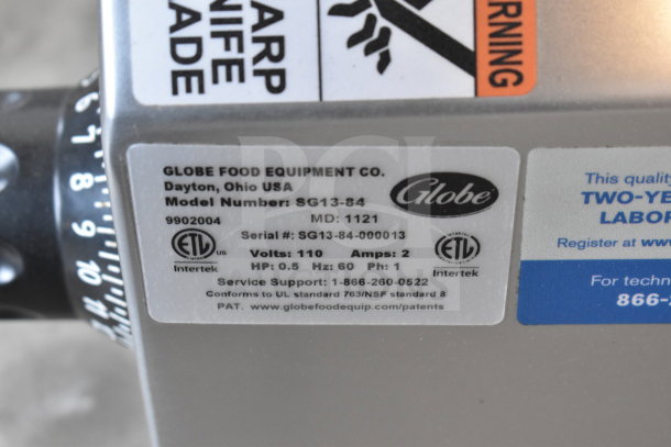 Globe SG13-84 commercial slicer label showing model, serial number, 110V, 1-phase power specs, ETL certification, and support details.