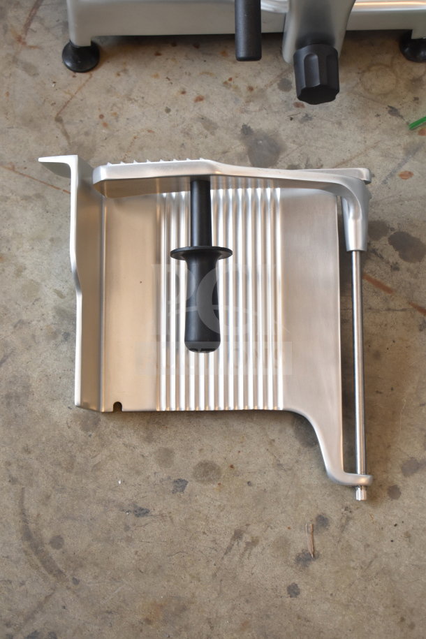 Globe G12 commercial slicer component featuring ribbed tray with handle, made of stainless steel. Item is new with minor dents.