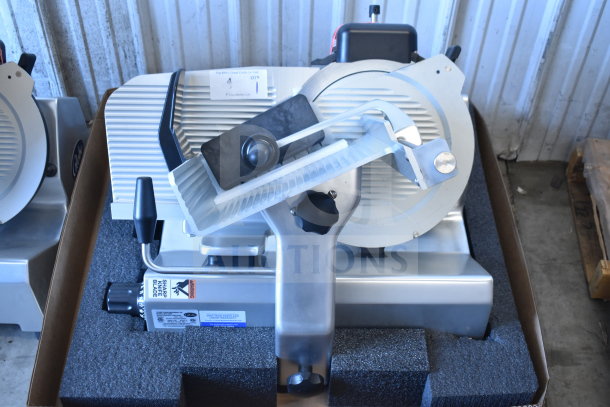 Brand new Globe SG13-84 commercial 13" automatic slicer with blade sharpener, 110 volts, shown in packaging.