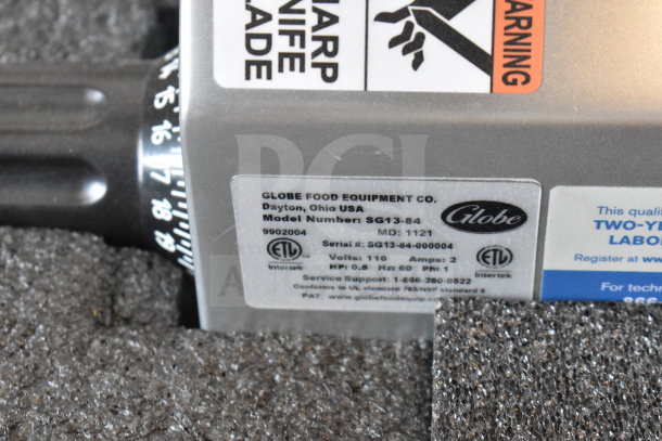 Globe SG13-84 slicer label showing model, serial number, 110V, 1 phase, ETL certification, and support info.