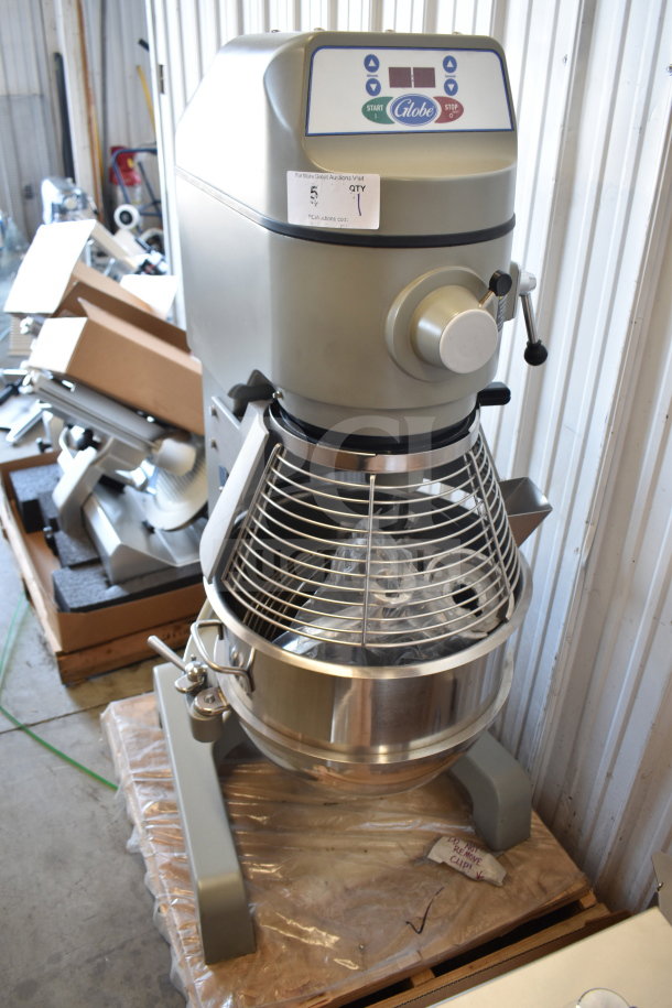 Brand new Varimixer SP40 commercial 40 Qt. planetary floor mixer by Globe, featuring manual bowl lift, bowl guard, dough hook, paddle, and whisk. Scratch and dent condition, 208V, 1 phase.