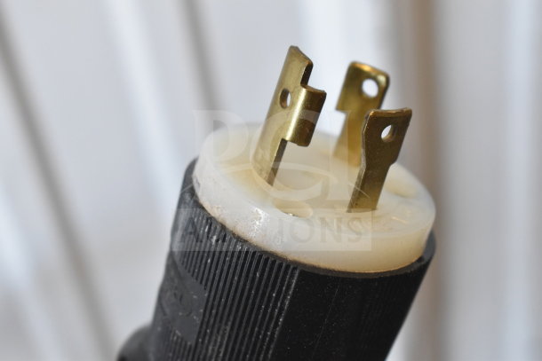Close-up of a three-prong power plug for the Varimixer SP40 mixer, showing gold connectors and black casing.