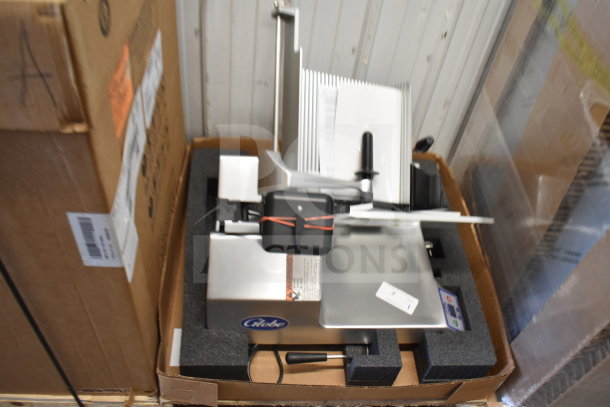 Globe SG13A commercial slicer, brand new with minor scratches, 13" blade, sharpener, in packaging, 110V, 1 phase.