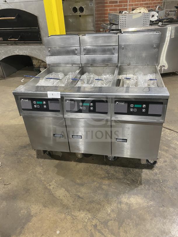 Pitco SG14-JS commercial stainless steel 40 lb. triple-bay deep fat fryer with digital control, backsplash, basket hanger, on casters.