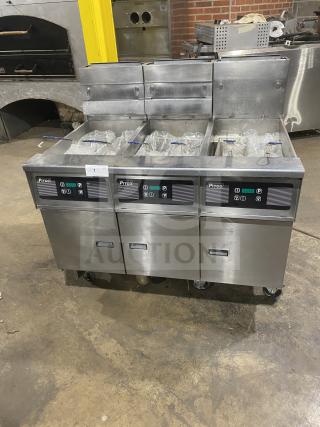 Pitco SG14-JS commercial stainless steel 40 lb. triple-bay deep fat fryer with digital control, backsplash, basket hanger, on casters.