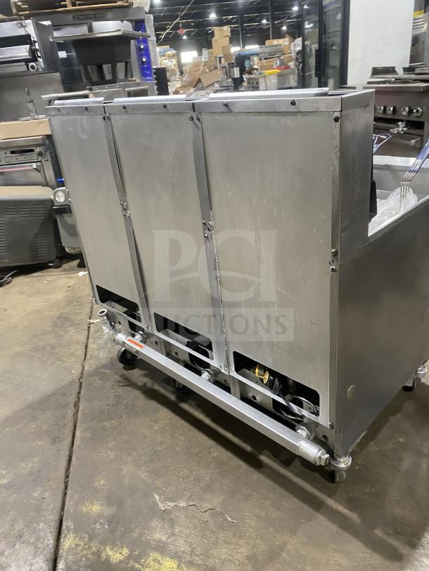 Pitco SG14-JS commercial stainless steel 40 lb. triple-bay deep fryer. Features digital control, basket hanger, casters.