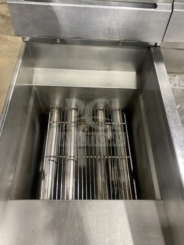 Pitco SG14-JS triple-bay deep fat fryer in stainless steel, includes digital control, back splash, basket hanger, on casters.