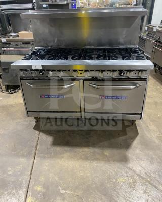 Bakers Pride stainless steel 10-burner gas range with double oven, overhead salamander shelf, and backsplash. Model 60BP10BS26N.