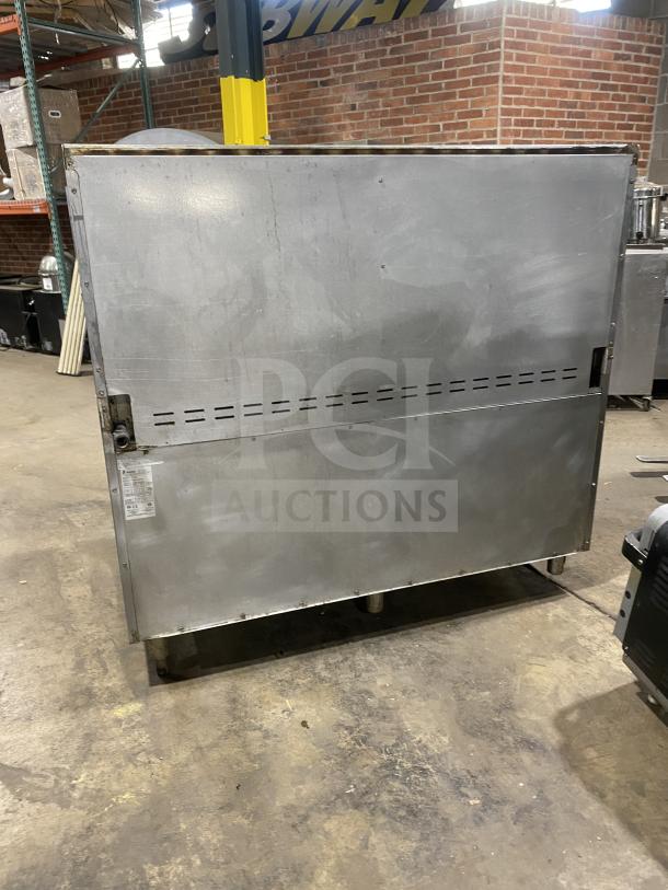 Bakers Pride stainless steel 10-burner range with double oven, back splash, salamander shelf, and wired rack, model 60BP10BS26N.