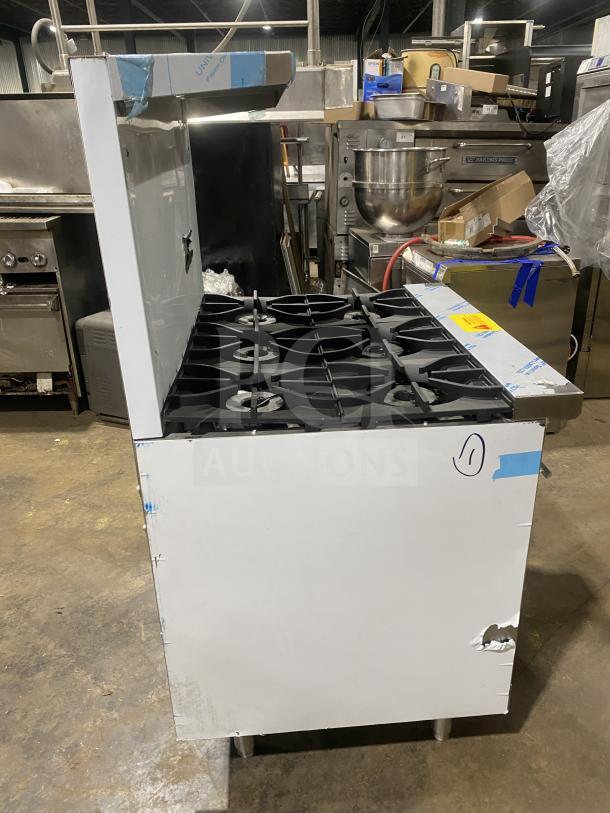 Kutano 36″ commercial stainless gas range, model KUT-6-BR-N-36-N6, with 6 burners and standard oven, on legs. New condition.