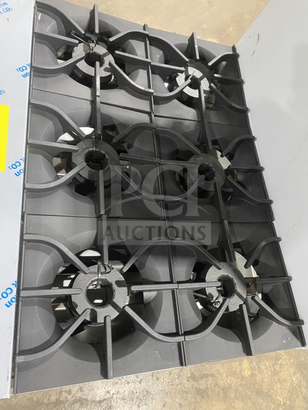 New Kutano 36" commercial stainless gas range model KUT-6-BR-N-36-N6 with 6 burners and standard oven on legs.