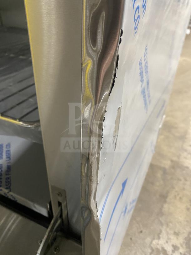 Kutano 36″ commercial stainless gas stove, model KUT-6-BR-N-36-N6, side view showing minor packaging damage.