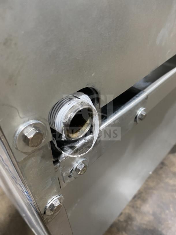 Close-up of a gas connection fitting on a Kutano KUT-6-BR-N-36-N6 commercial stainless restaurant oven.