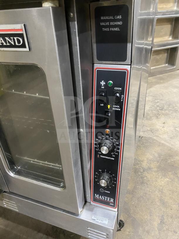 Garland Master 300 stainless steel double-stacked convection oven, view-through door, manual gas control, on casters.
