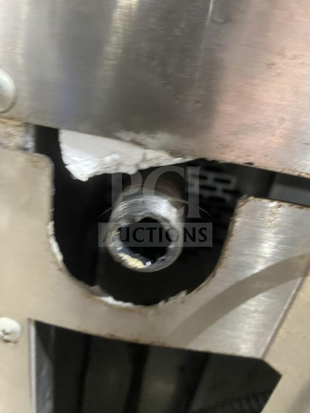 Close-up of connection point on Garland Master 300 convection oven, showing metalwork and part of the viewing door.