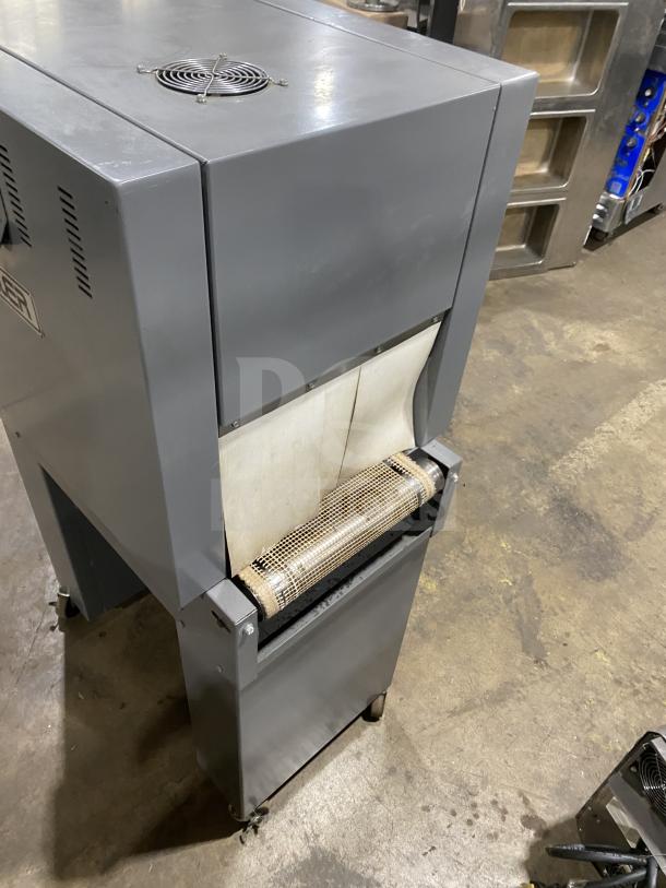 Beseler shrink wrap system, model HS-1520D, heat tunnel TD-16-10, electric, heavy-duty, on casters, good condition.