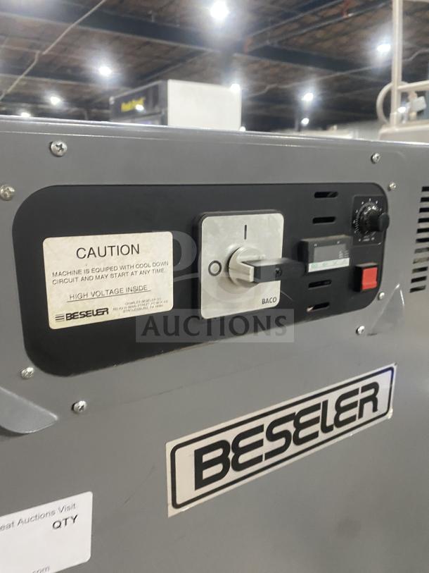 Beseler shrink wrap system, Model HS-1520D and TD-16-10, on casters, 115V/220V, features control panel with caution label.