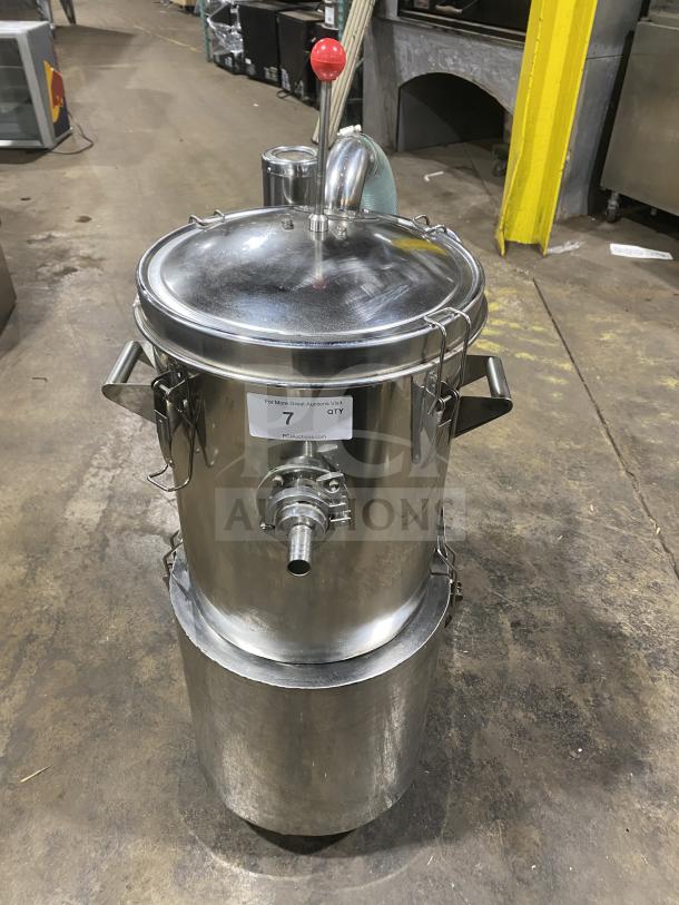 Commercial stainless steel vacuum syrup filter press canister. Features durable construction, a red handle, and attached nozzle.