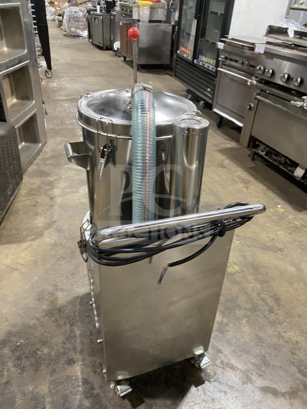 Commercial stainless steel vacuum syrup filter press, featuring a large canister and hoses. Excellent, clean condition.