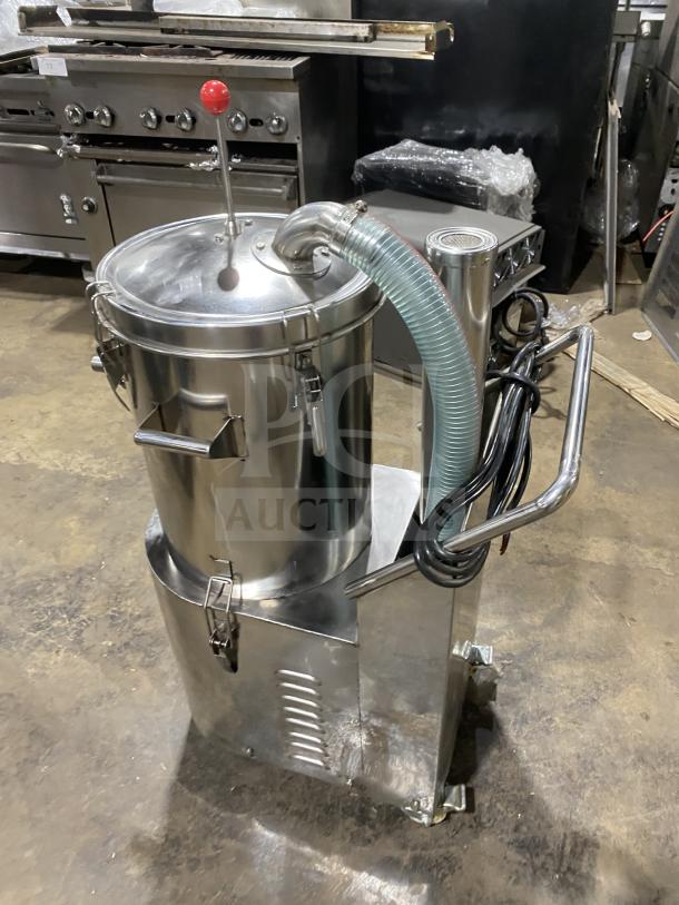 Commercial stainless steel vacuum syrup filter press with canister and attached hose, excellent condition.