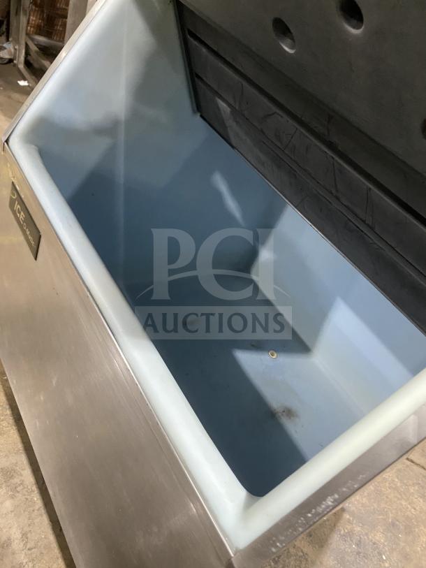 Manitowoc SD0452A stainless steel ice maker/bin combo, electric powered, lift open access, in used condition.