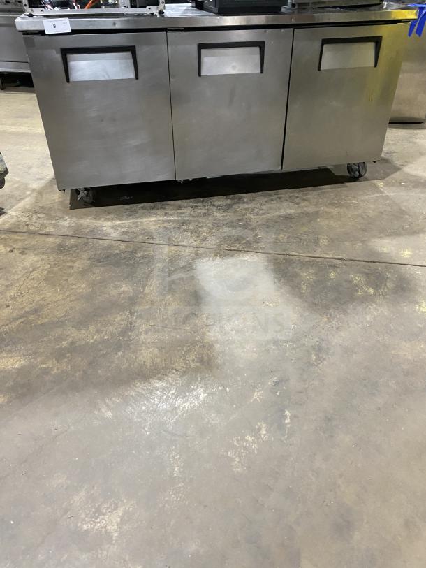 True TUC-72 stainless steel 3-door worktop refrigerator, Energy Star certified, upturned backsplash, on casters, model TUC-72.