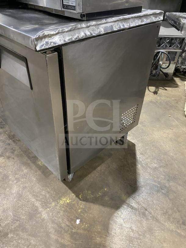 True TUC-72 stainless steel 3-door refrigerator with upturned backsplash, Energy Star certified, on casters. Model 6858656.