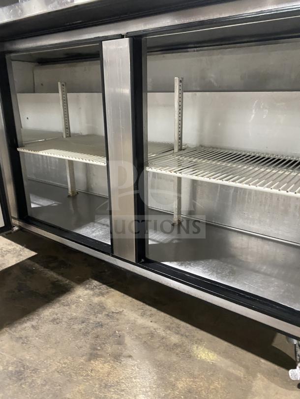 True TUC-72 stainless steel 3-door worktop refrigerator in good condition, Energy Star certified, with backsplash and casters.