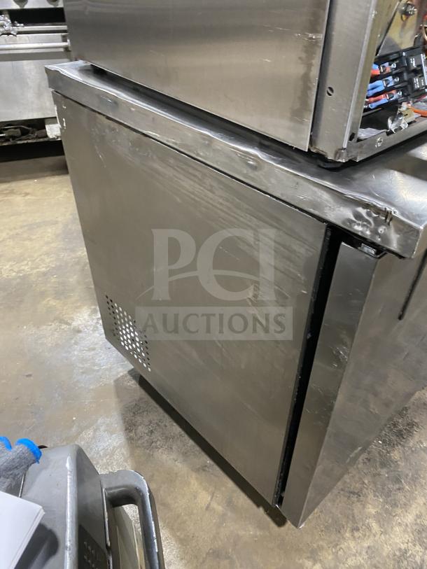 True TUC-72 stainless steel 3-door worktop refrigerator with upturned backsplash. Energy Star certified, on casters, 115V.