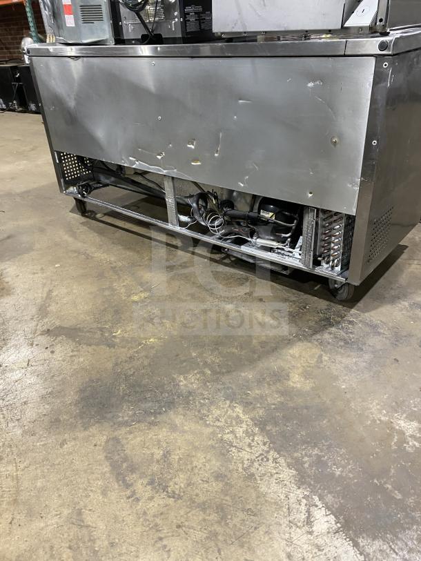 True 3-Door 72" worktop refrigerator, stainless steel, Model TUC-72, Energy Star certified, on casters, upturned backsplash.