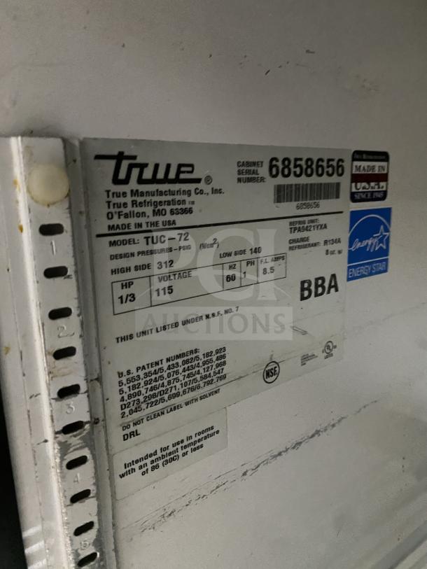 True TUC-72 3-door stainless steel worktop refrigerator, Energy Star, with upturned backsplash, on casters.