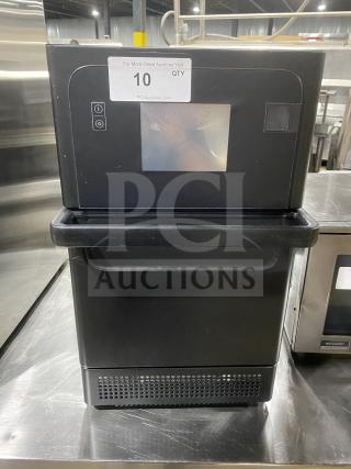 MerryChef black electric high-speed rapid cook oven, countertop model, good condition, visible touch controls, auction tag.