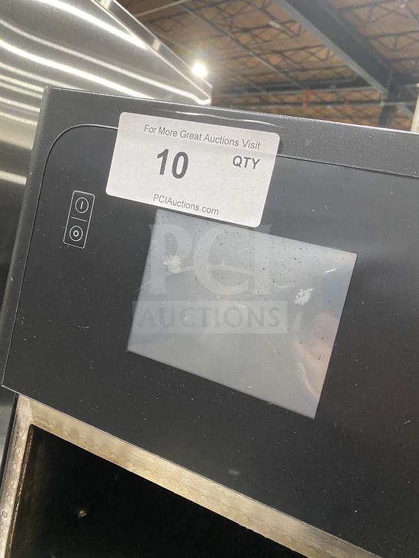 MerryChef black electric high-speed rapid cook oven, countertop model. Visible screen and panel with label indicating auction quantity.