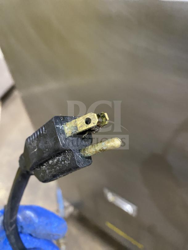 Sharp R-22GT-F commercial countertop microwave, stainless steel, showing electric plug. Model: R-22GT-F, SN: 09918.