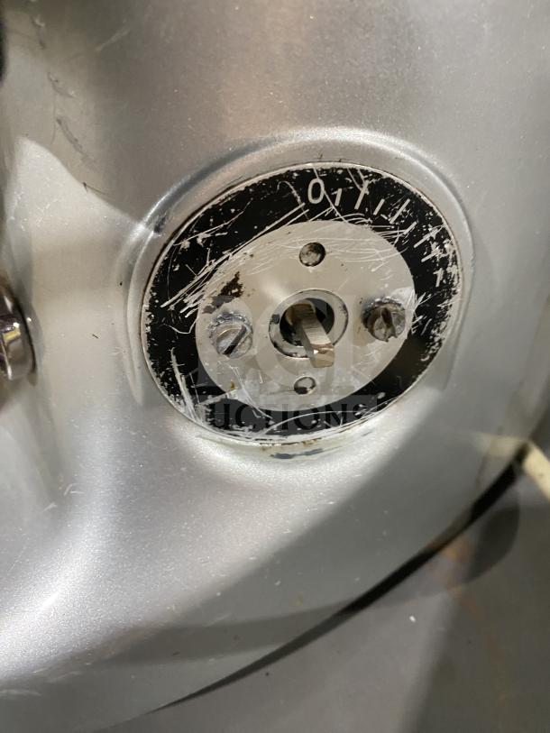 Mahlkonig Super Jolly Timer espresso grinder detail. Visible scratched dial for adjustments, model SN: 0303154, 110V 1 Phase.