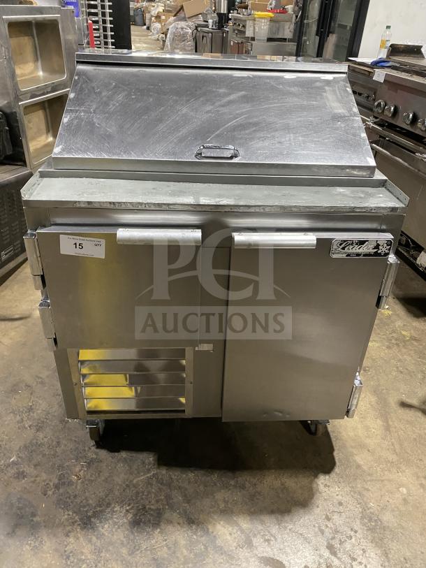 Leader LM36 S/C stainless steel refrigerated sandwich prep table on casters, 115V, with vented front and branded label.