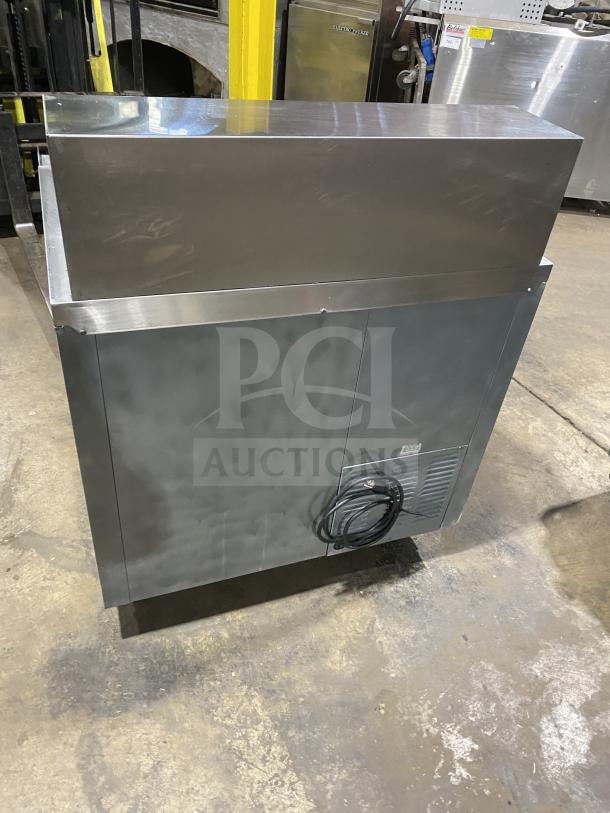 Leader LM36 S/C stainless steel refrigerated sandwich prep table, on casters. Model: LM36 S/C, Serial: PS020522, 115V 1 Phase.