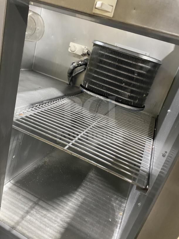 Leader LM36 S/C stainless steel refrigerated prep table; interior shelving and components visible. Condition: used.