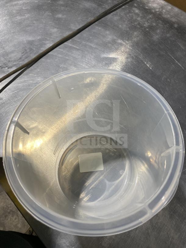 Clear Rubbermaid round storage container, commercial grade, in excellent condition with visible recycling label inside.