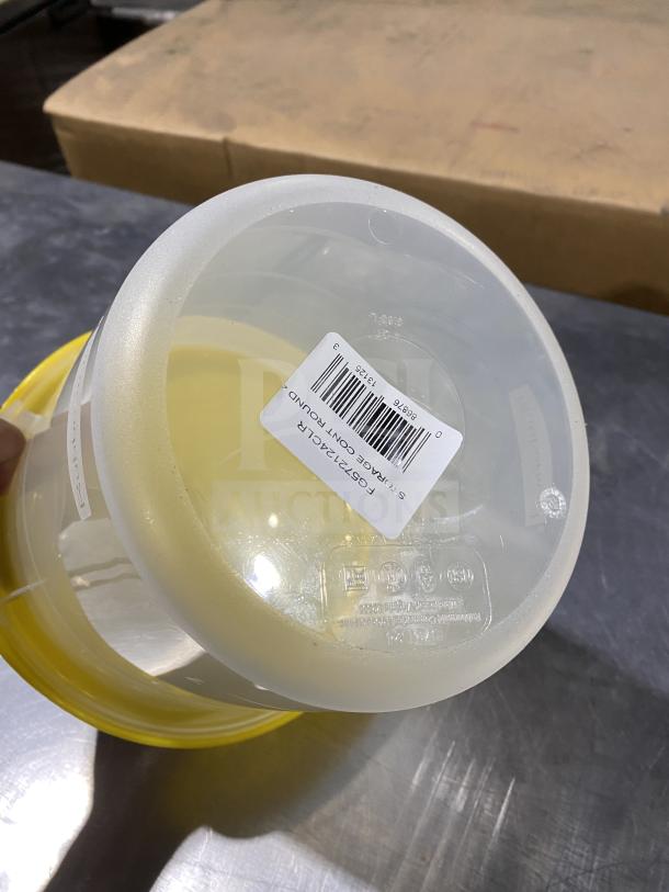 Rubbermaid round storage container, commercial grade, yellow lid, barcode tag visible, excellent condition.