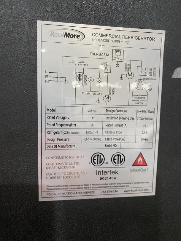KoolMore Commercial Refrigerator, Model MDR-9CP, 115V. Features a black finish and glass swing door. Includes poly coated wired rack.